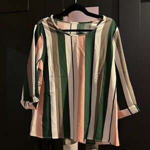 Woman’s stripped blouse. Never worn. No tags
